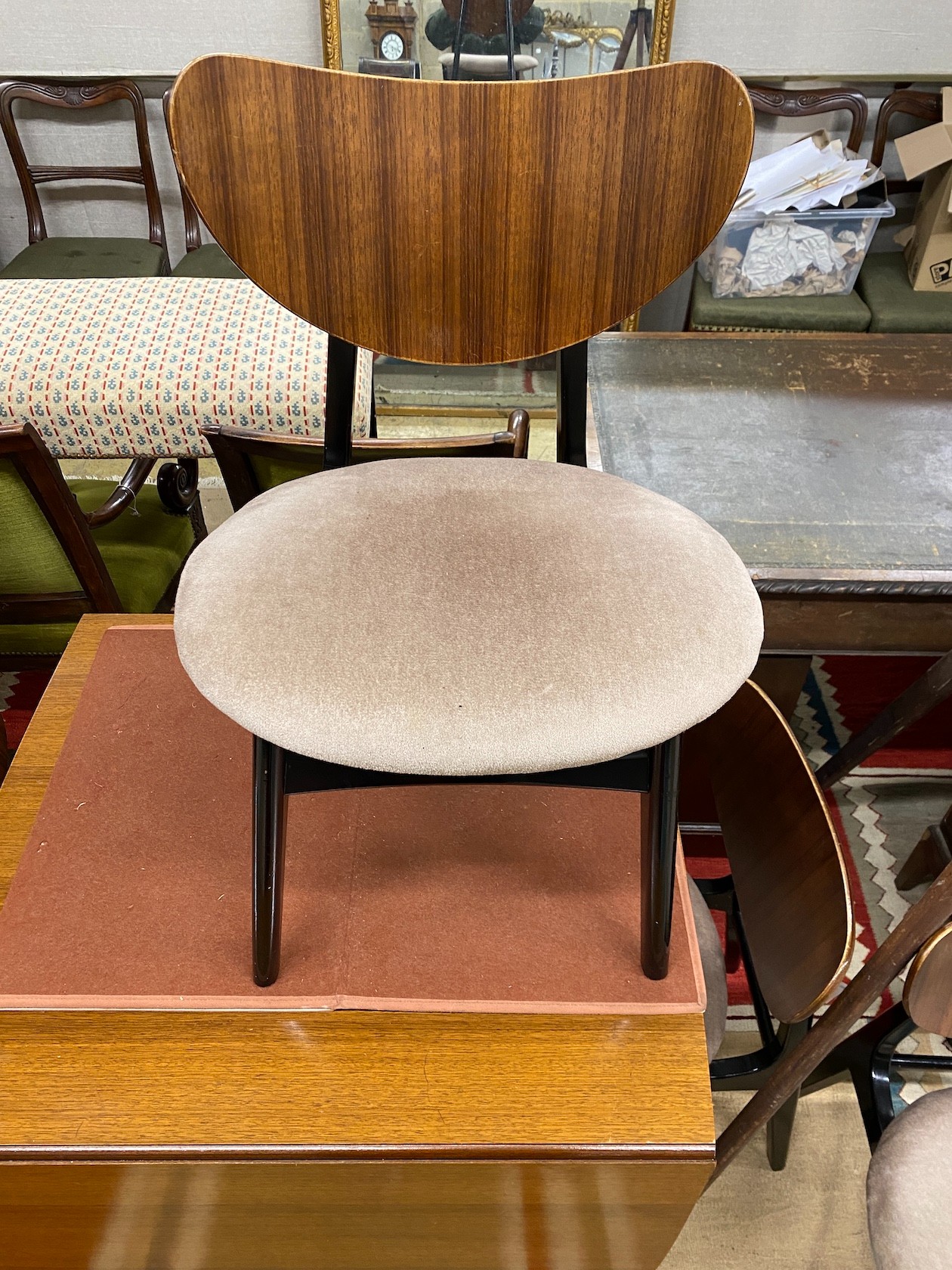 A 1950's G-plan table, approx. 150cm extended, width 82cm, height 72cm and four chairs